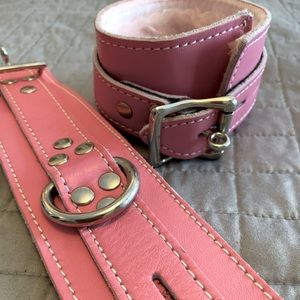 Pink leather furry handcuffs.